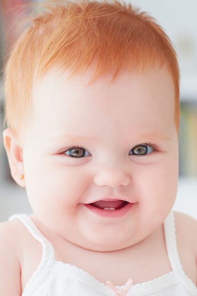 cute smiling red headed baby girl